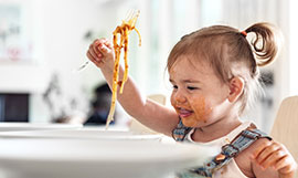 Child eating pasta